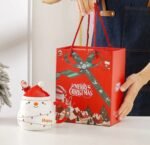 CHRISTMAS MUG WITH SANTA HAT LID AND SPOON IN A GIFT BOX
